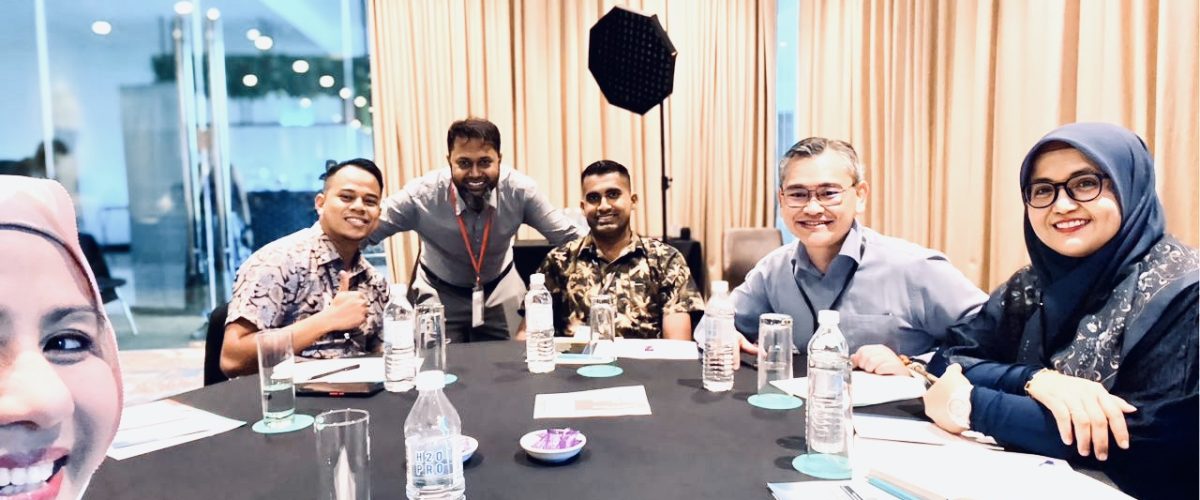 Tanzil Aslam with clients